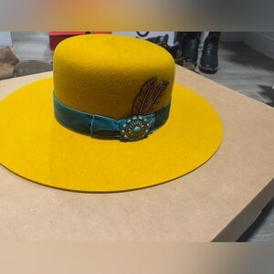 Elegant Yellow Hat with Teal Band and Feather Accent